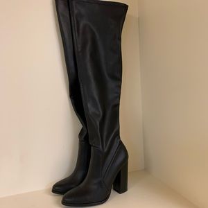 Thigh high heeled boots
